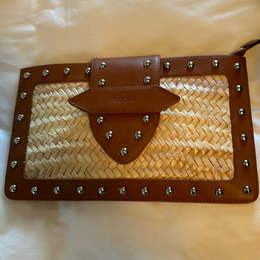 Poolside straw and leather clutch